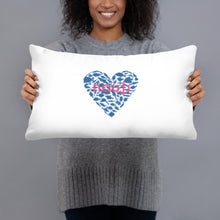 "NAUTI" fish heart pillow in white with navy fish heart and magenta logo