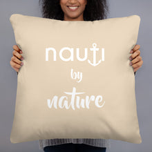 "NAUTI BY NATURE" pillow in champagne with white logo