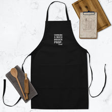 Mens "Swinging a much bigger prop" Embroidered Apron in black with white logo