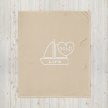 "NAUTI" boat life blanket in champagne with white logo