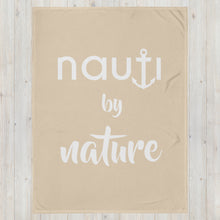 "NAUTI BY NATURE" blanket in champagne with white logo