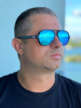 Unisex Floating Polarized "Nauti" Aviators Sunglasses in Sea Blue Lens on Deep Blue (Semi-Transparent) Frame.